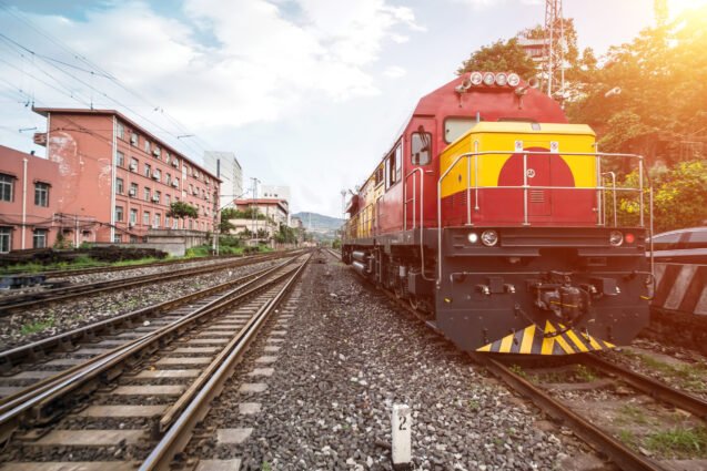 industry container trains running on railways track against beautiful sun set sky use for land transport and logistic business